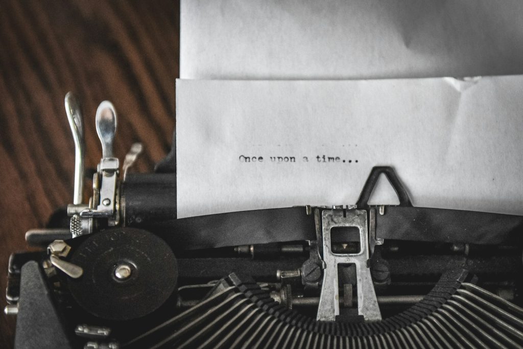 Vintage typewriter with paper saying "once upon a time..."